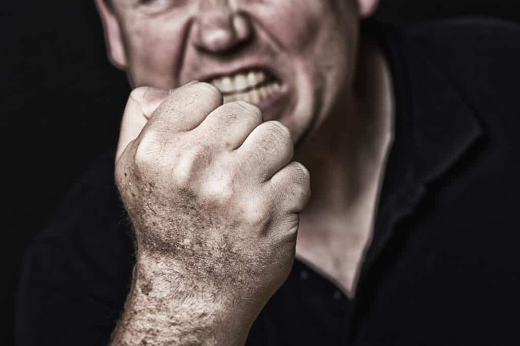 Man making threats with fist. 
