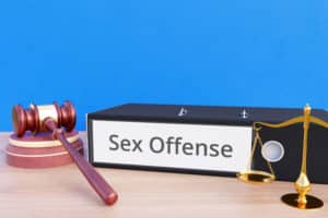Binder with sex offense label