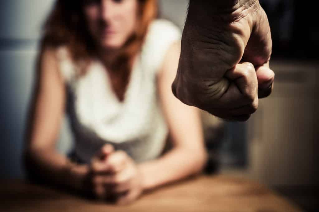 Man with clenched fist and woman