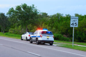 Police arresting driver for a operating with a suspended license 