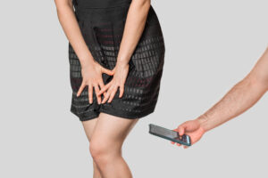 Secretly photographing or videotaping a nude or partially nude person